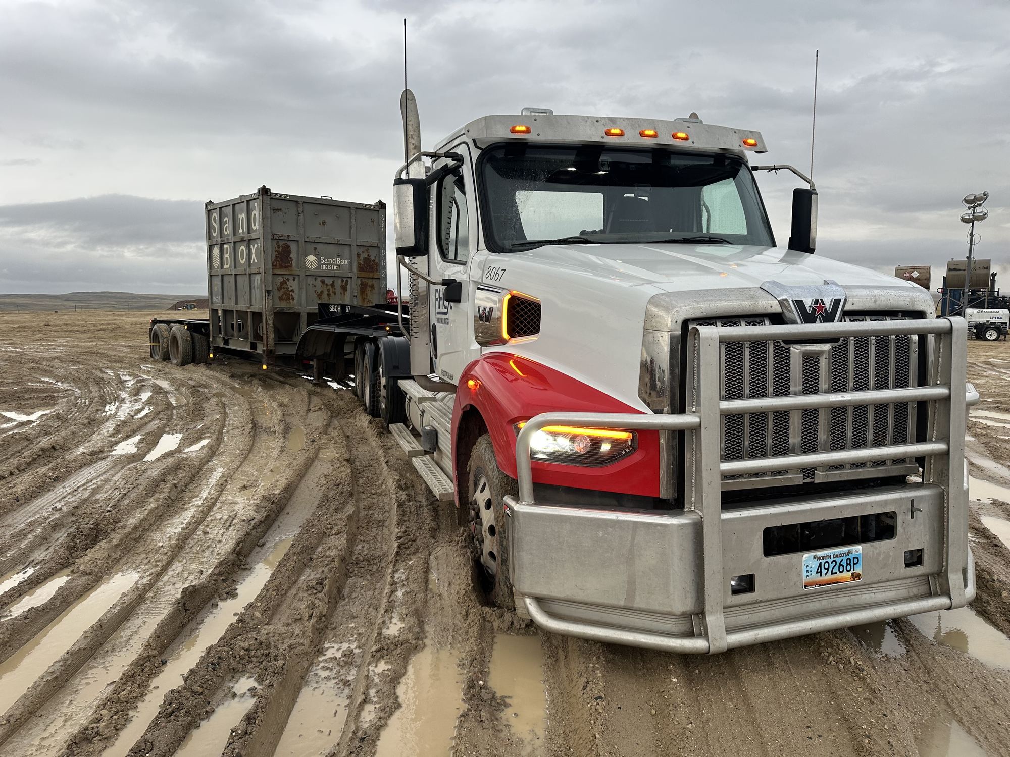 Truck on a muddy lease road